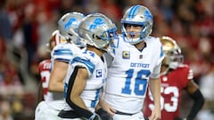 SANTA CLARA, CALIFORNIA - DECEMBER 30: Jared Goff #16 and Amon-Ra St. Brown #14 of the Detroit Lions celebrate their touchdown connection against the San Francisco 49ers during the third quarter at Levi's Stadium on December 30, 2024 in Santa Clara, California.   Ezra Shaw/Getty Images/AFP (Photo by EZRA SHAW / GETTY IMAGES NORTH AMERICA / Getty Images via AFP)