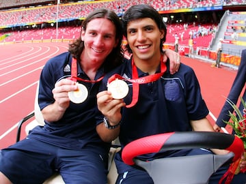 BEIJING - AUGUST 23: Argentinian forwards Lionel Messi (L) and Sergio Aguero  gold medal pose during the men's Olympic football tournament medal ceremony at the national stadium in Beijing during  the Men's Final between Nigeria and Argentina at the National Stadium on Day 15 of the Beijing 2008 Olympic Games on August 23, 2008 in Beijing, China. (Photo by Koji Watanabe/Getty Images)