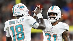 CLEVELAND, OHIO - DECEMBER 29: Tyler Huntley #18 of the Miami Dolphins celebrates a touchdown with Raheem Mostert #31 during the third quarter against the Cleveland Browns at Huntington Bank Field on December 29, 2024 in Cleveland, Ohio.   Nick Cammett/Getty Images/AFP (Photo by Nick Cammett / GETTY IMAGES NORTH AMERICA / Getty Images via AFP)