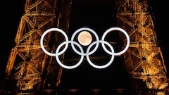 -- AFP PICTURES OF THE YEAR 2024 --

The moon rises behind the Olympic rings displayed on the Eiffel Tower in Paris on July 22, 2024, ahead of the Paris 2024 Olympic Games. (Photo by Loic VENANCE / AFP) / AFP PICTURES OF THE YEAR 2024